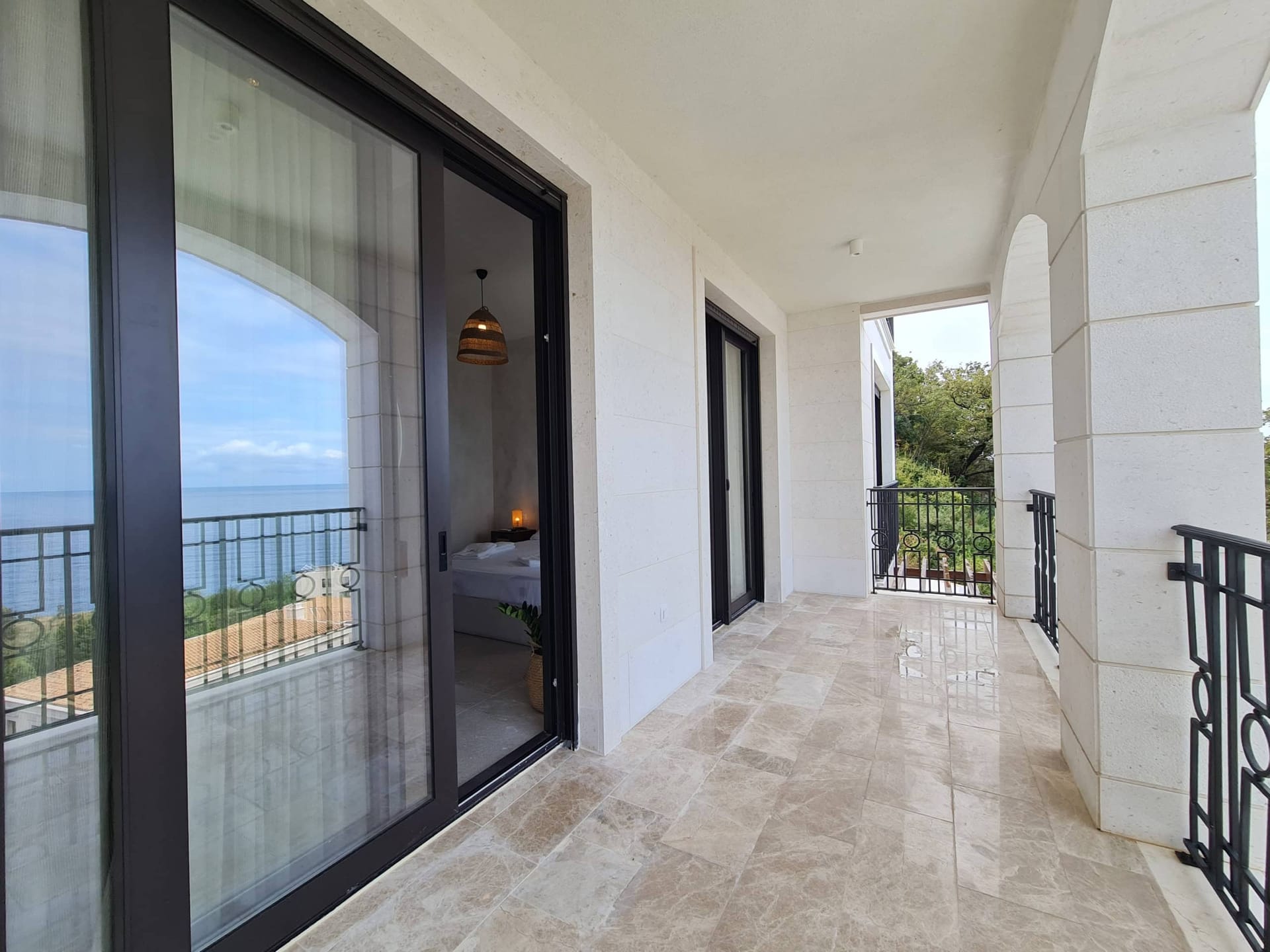 Spacious terrace with stone finishes and sea view at a villa in Skočidjevojka, Budva, Montenegro.