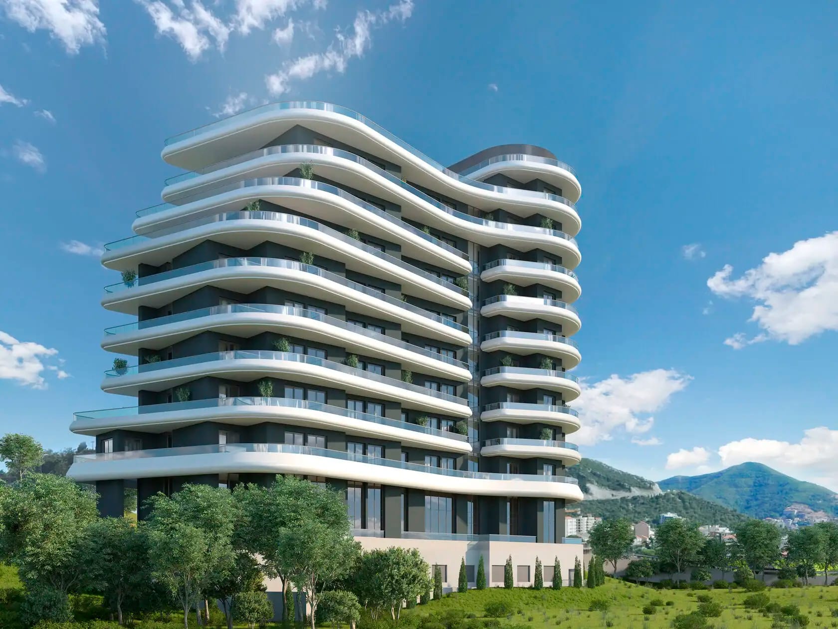 Savremeni stambeni kompleks sa panoramskim balkonima u Bečićima, Crna Gora: arhitektura i pogled na planine.