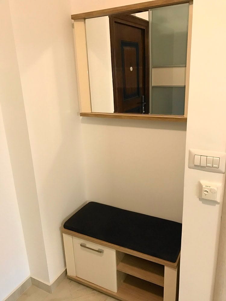 Entryway with a mirror and shoe cabinet in an apartment, Dobri Vody, Montenegro. Modern interior finishes.