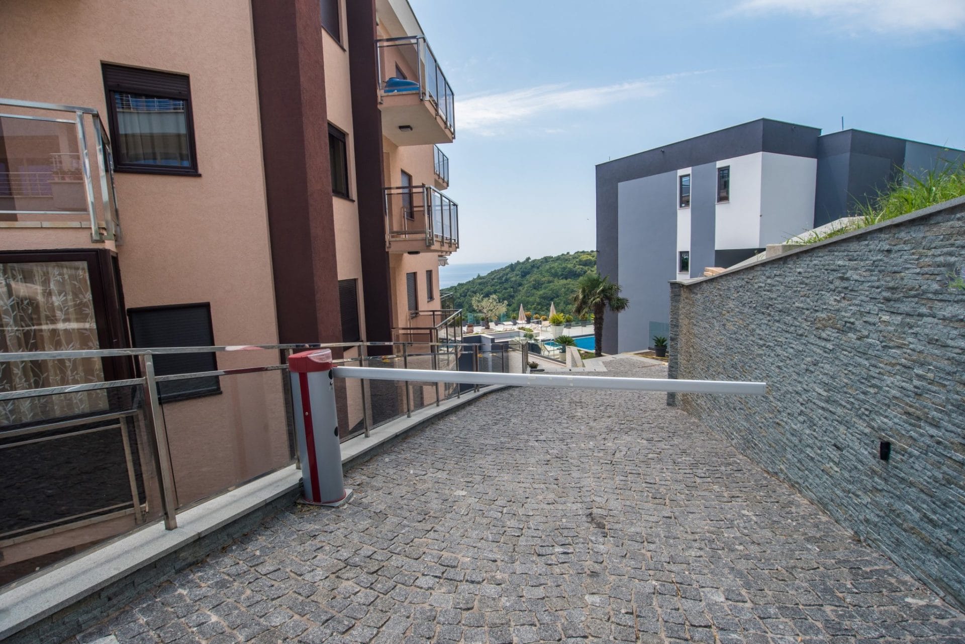 Gated entrance to the villa’s private grounds in Budva, Montenegro, with sea and pool views.