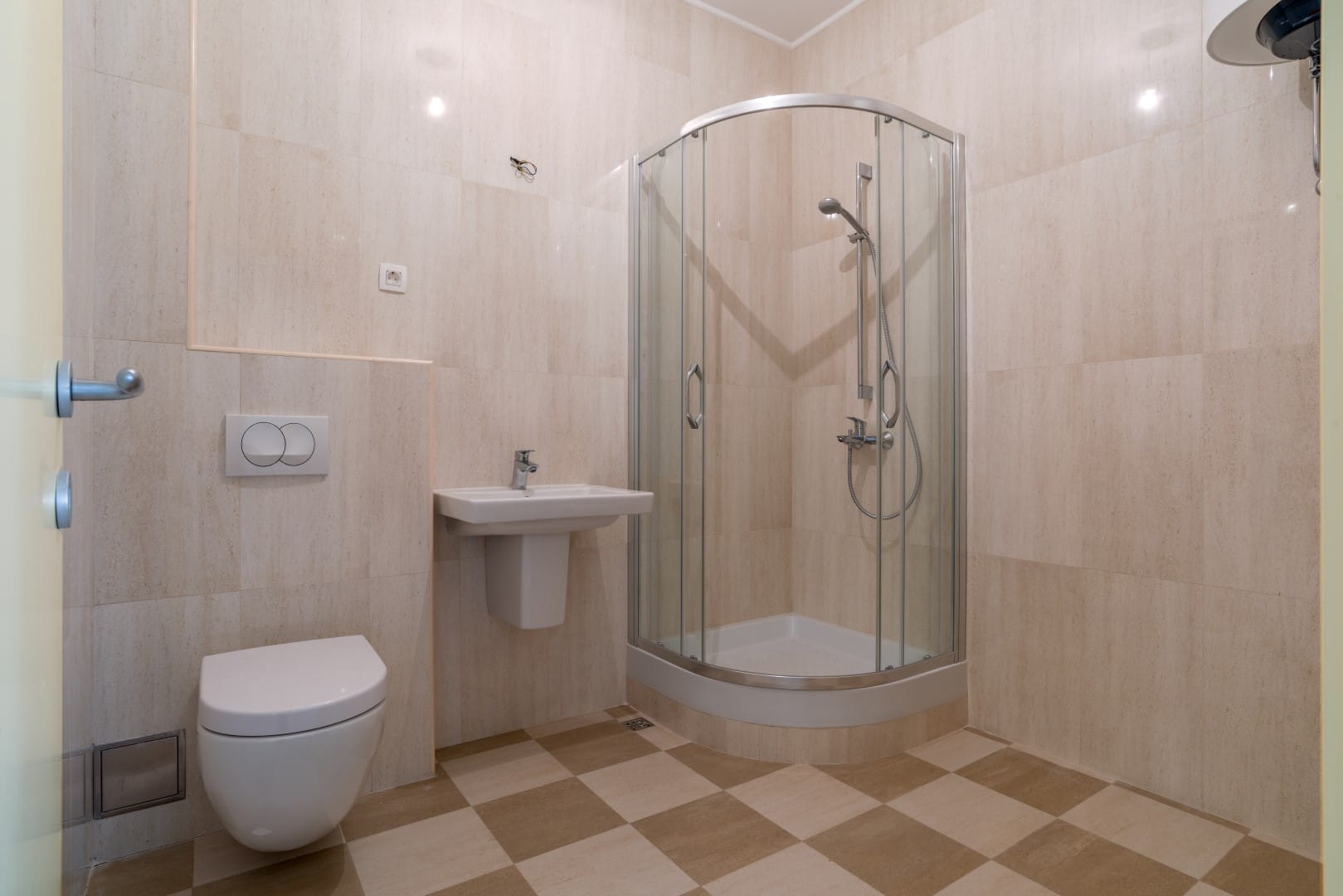 Modern bathroom with a shower cabin in the Orahovac residential complex, Bay of Kotor, Montenegro.