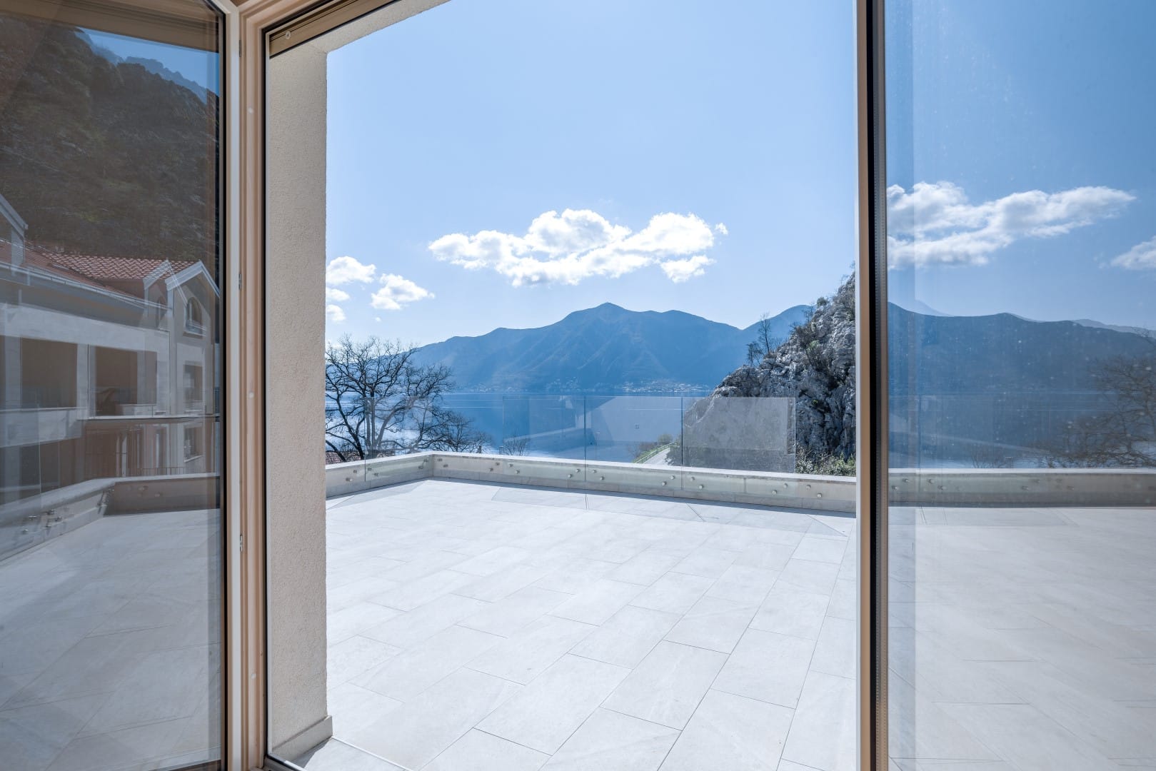 Spacious terrace with panoramic views of the mountains and sea in a residential complex, Orahovac, Bay of Kotor, Montenegro.
