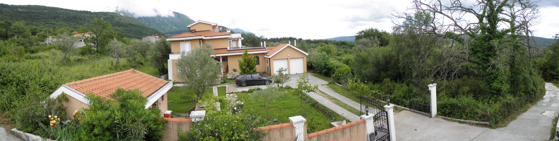 Two-story villa with garage and garden in Kavac, Bay of Kotor, Montenegro: view of the plot and mountains.
