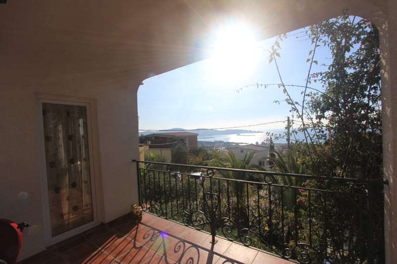 Balcony with wrought-iron railing and sea view in a building, Shushan, Montenegro.