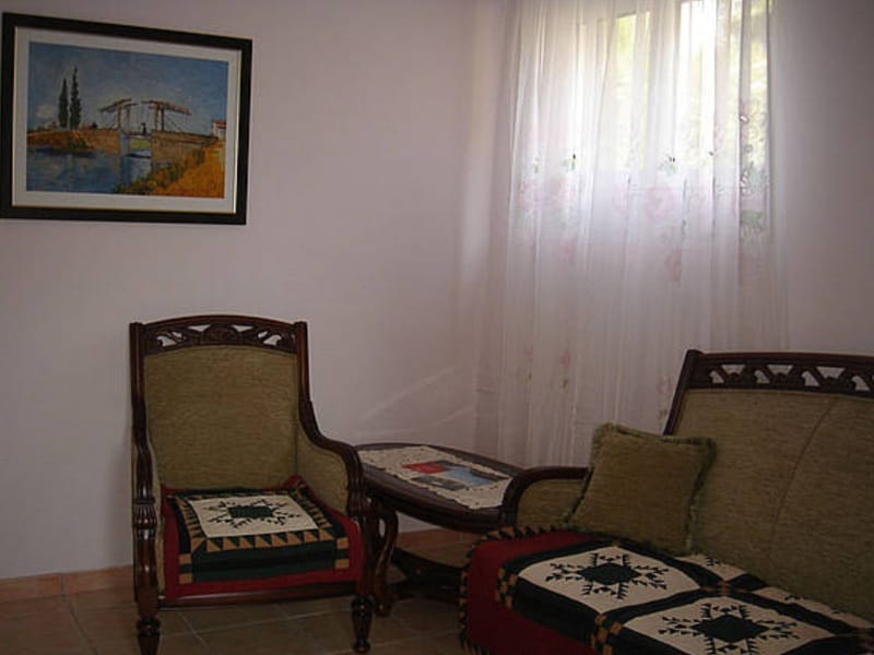 Cozy living room with classic furniture and a painting on the wall in a villa, Shushan, Montenegro.