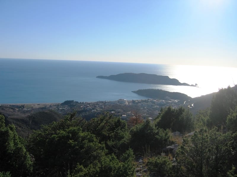 Panoramic view of the sea, St. Nicholas Island, and Budva from a plot of land in Montenegro, top view.