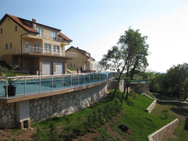 Modern villa with a pool and terrace in Bar, Montenegro: view of the residential complex and landscaped grounds.