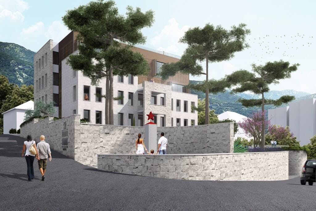 Savremeni stambeni kompleks u Tivtu, Crna Gora: kamena fasada, panoramski prozori i uređeno dvorište.