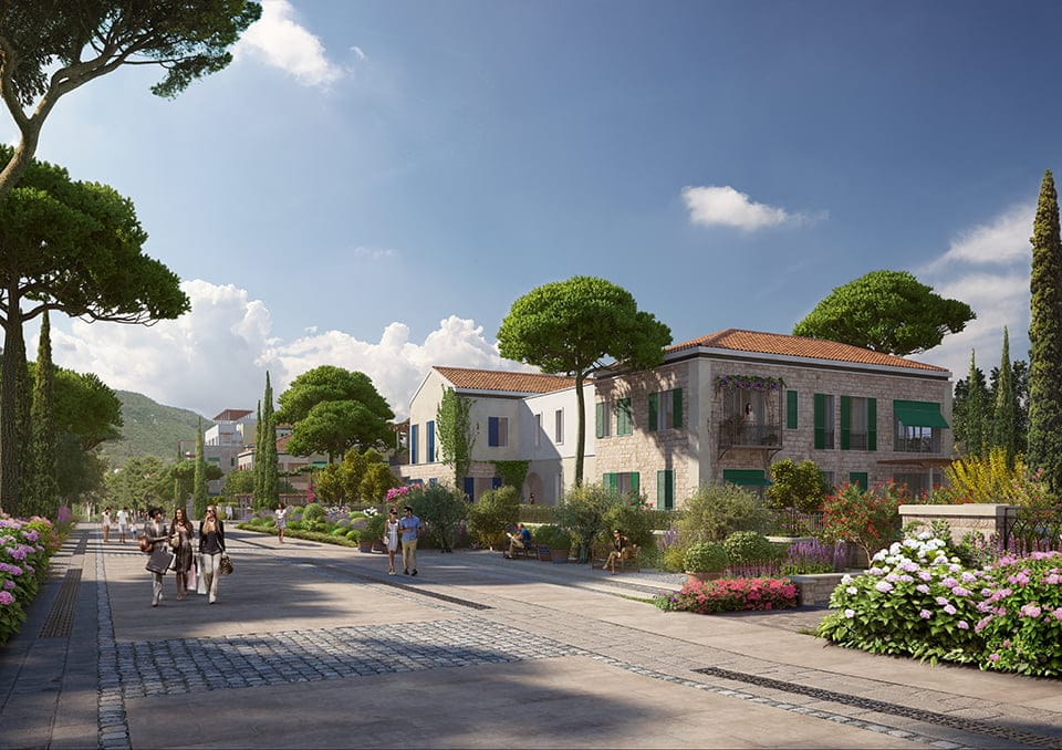 View of the luxury Porto Novi residential complex in Kumbor, Montenegro: stone villas, landscaping, and a promenade area.