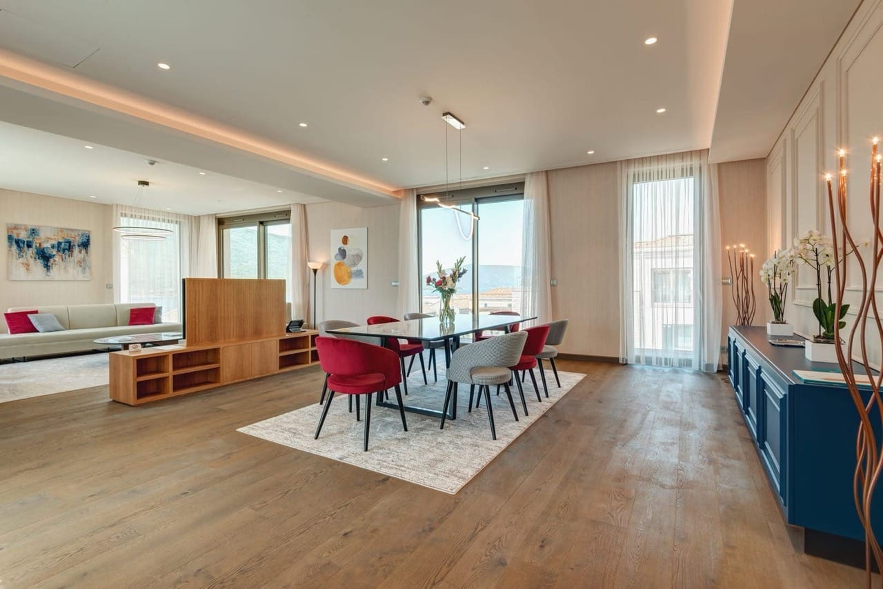 Modern living room with dining area in an apartment in Portonovi, Kumbor, Montenegro: designer furniture and sea view.
