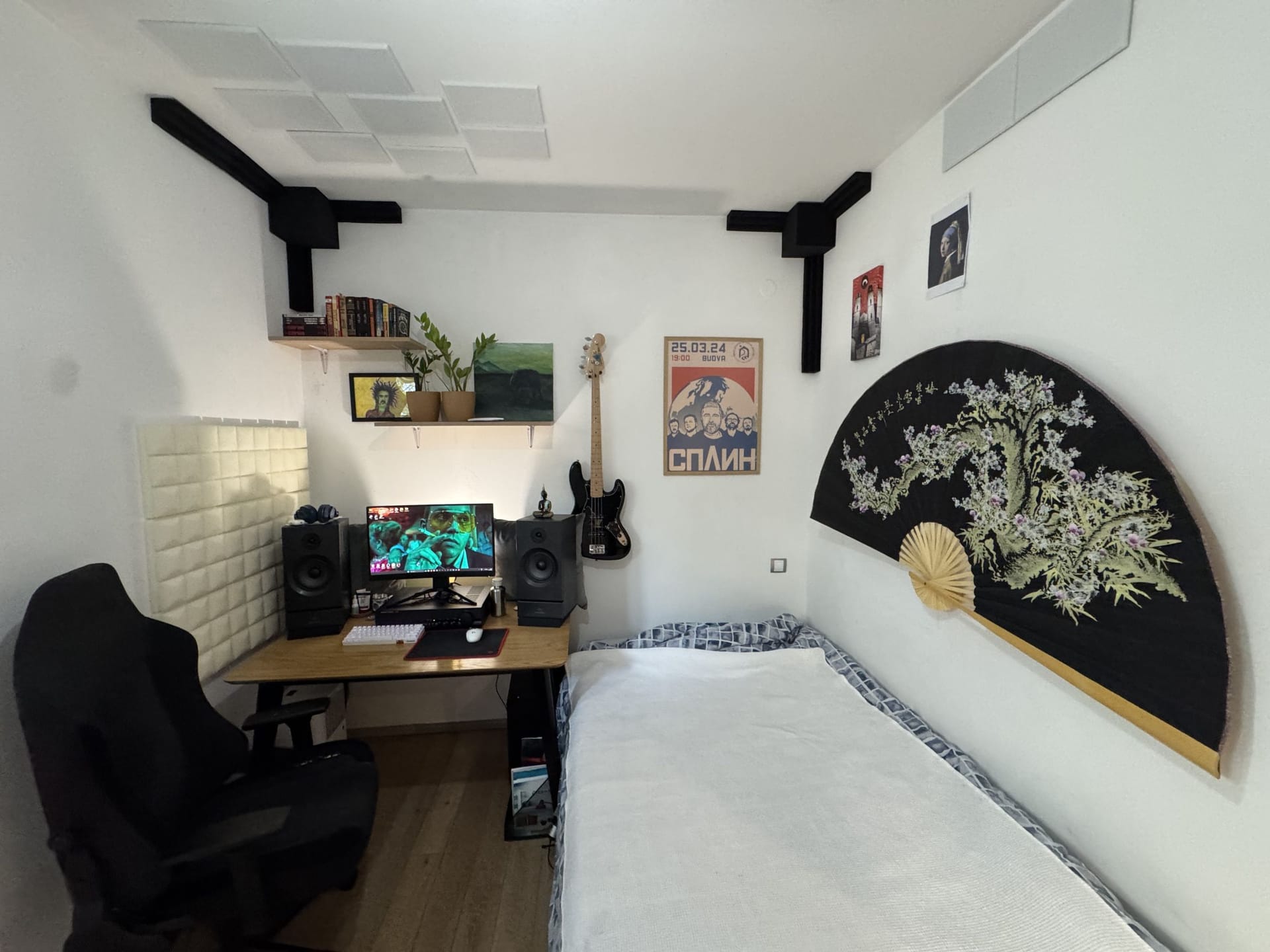 Cozy bedroom with a workspace and bed in an apartment, Dobrota, Montenegro: stylish interior with decor.