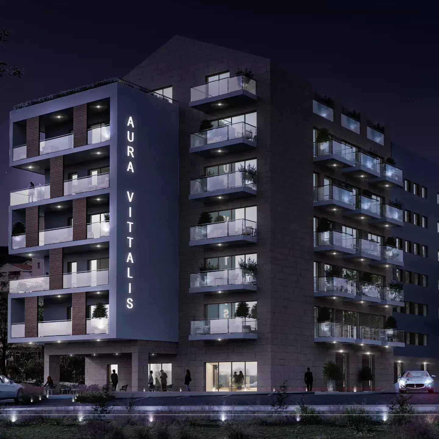 Modern residential complex Aura Vittalis in Budva, Montenegro: night facade with lighting and glass balconies.