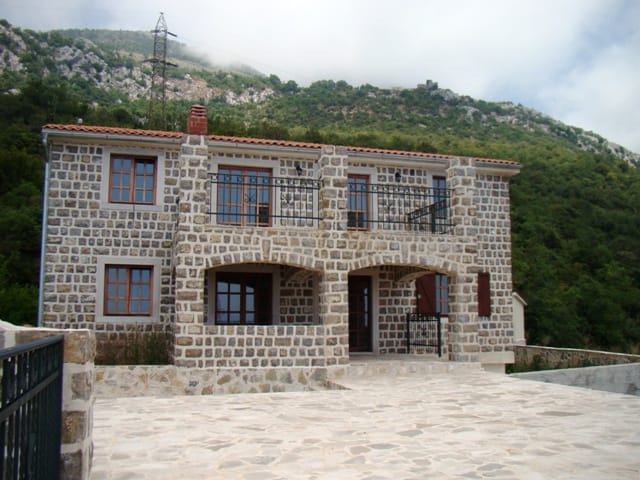 Two-story natural stone house with a terrace and balcony in the mountains, Petrovac, Montenegro.