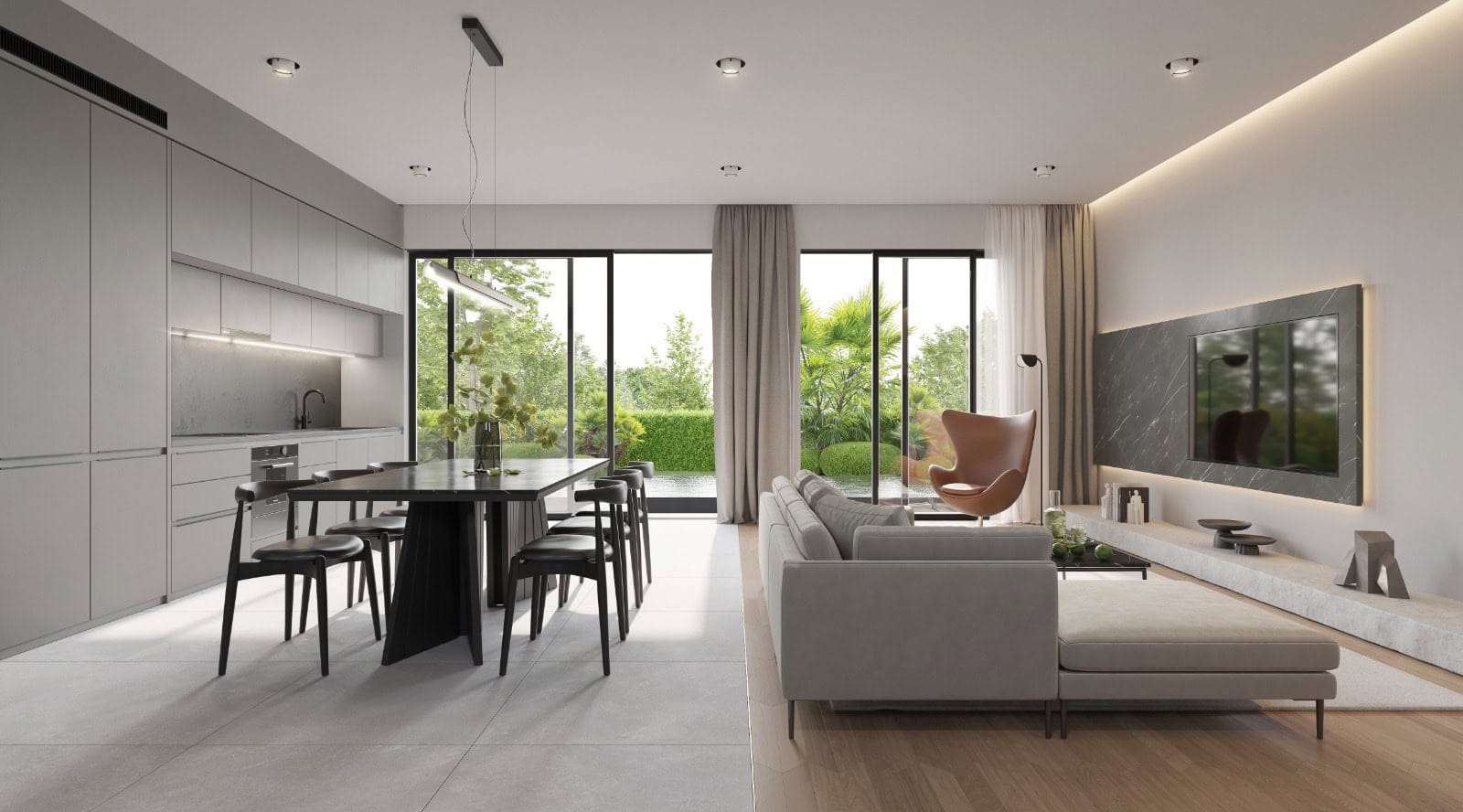 Modernes Wohnzimmer mit Küche in einer Villa in Krimovica, Montenegro: Panoramafenster, stilvolle Möbel und Blick auf den Garten.