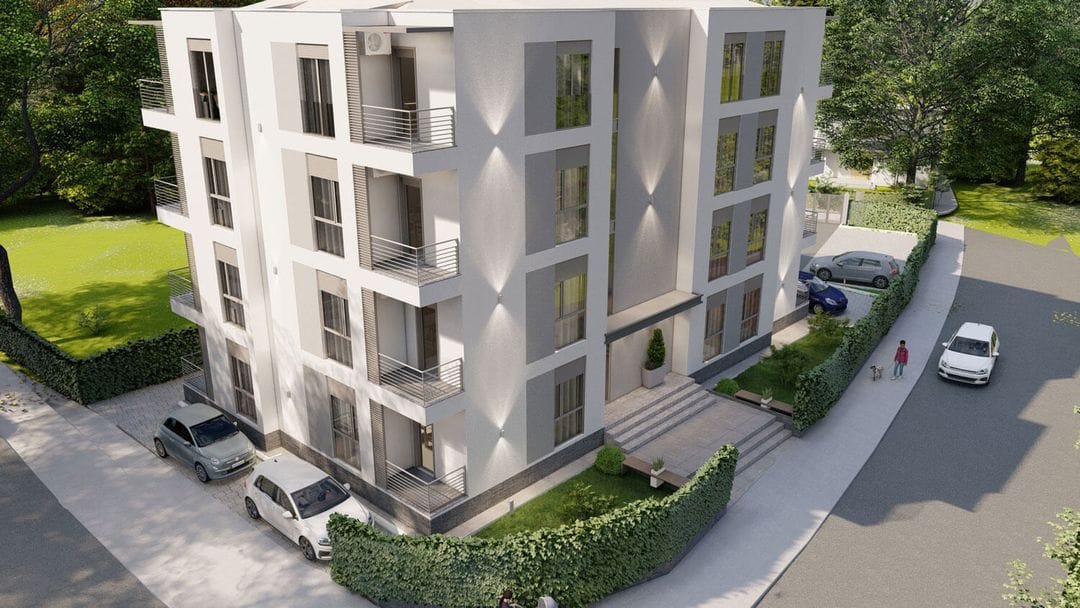 Modern residential complex with balconies and parking in Podgorica, Montenegro: view of the building and surrounding area.