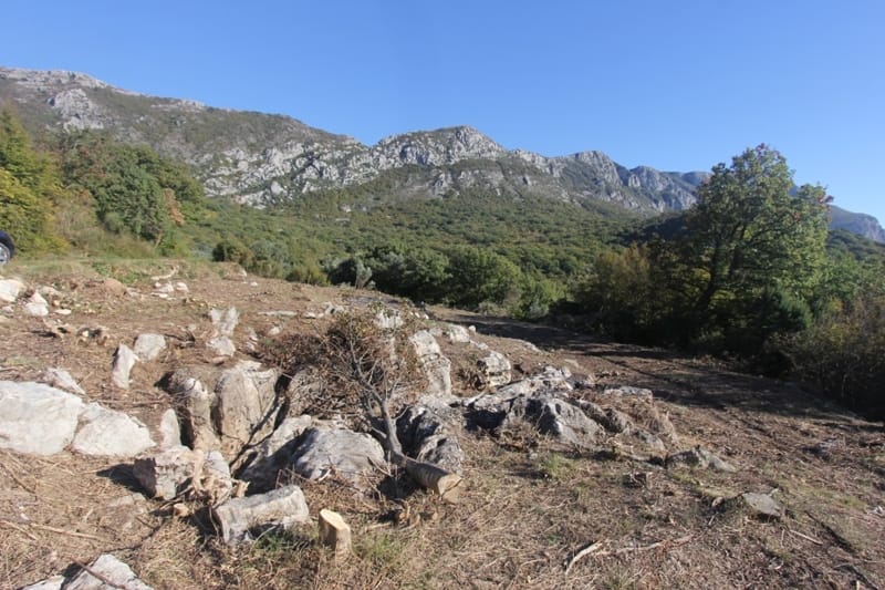 Land plot for construction in Sveti Stefan, Montenegro, with panoramic views of the mountain landscape.