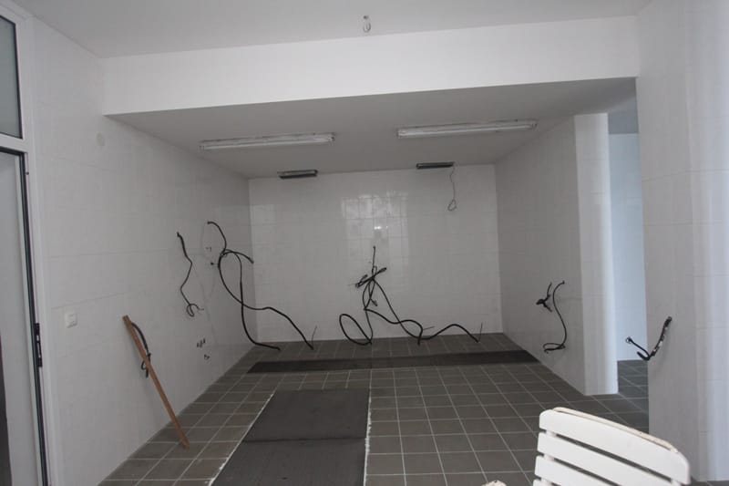 Restaurant kitchen space in Sveti Stefan, Montenegro: tiled finish, utility connections, rough finish.