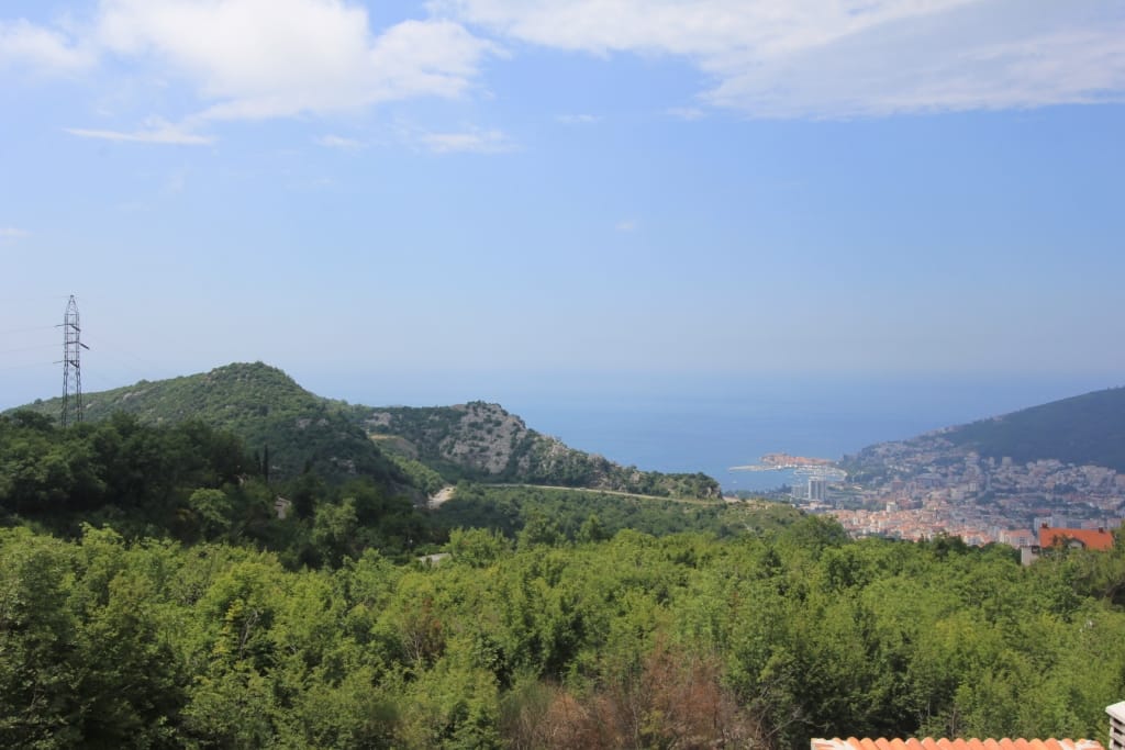 Panoramic view of the sea and the city of Budva from a plot of land in the village of Markovichi, Montenegro.