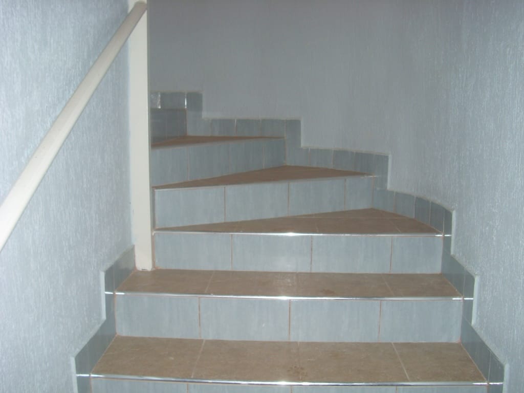 Interior staircase with tiled finish and railings in a villa, Markovichi village, Montenegro.