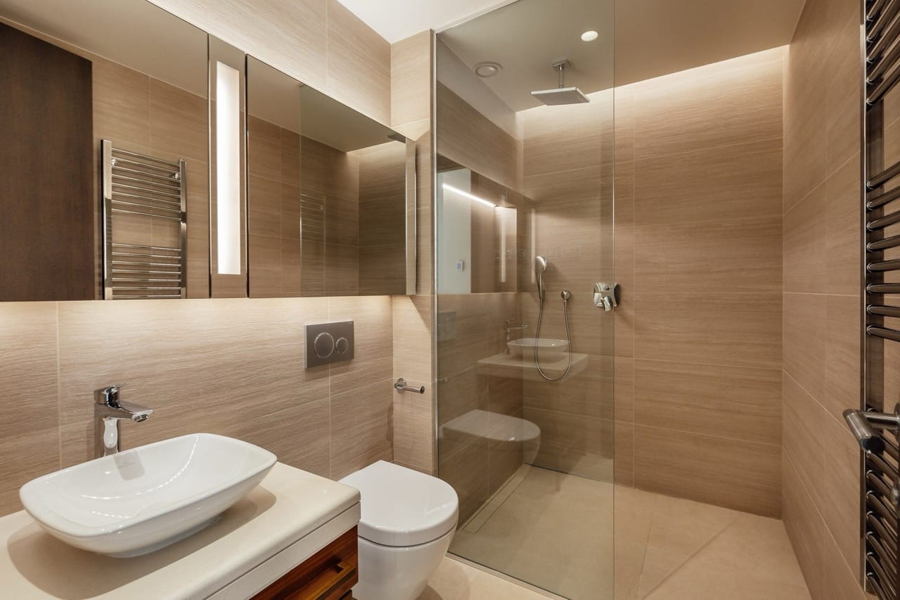 Modern bathroom with a shower cabin and wood-style finishes in a villa in Portonovi, Kumbor, Montenegro.