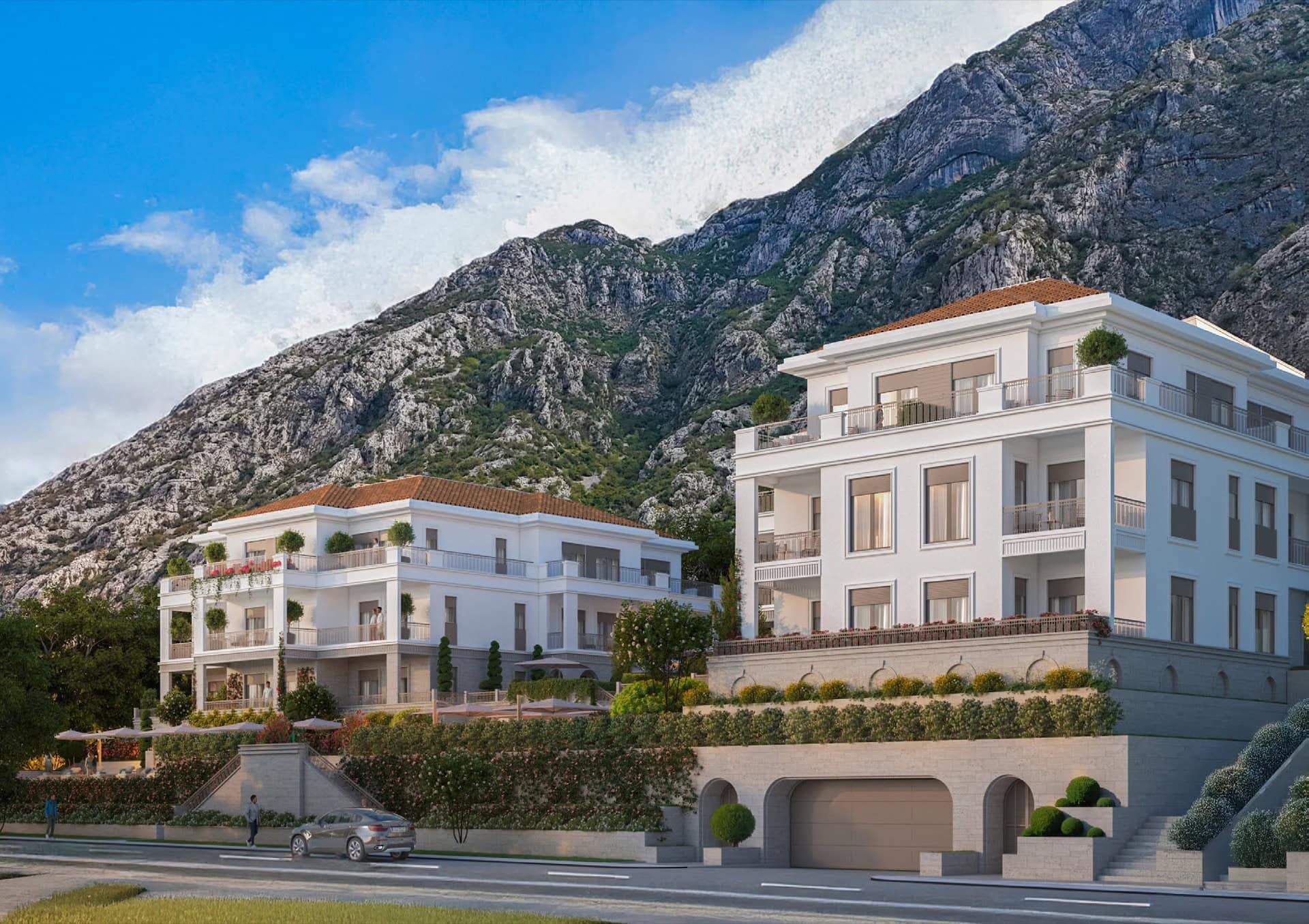 Complexe résidentiel moderne à Luštica, Monténégro : villas blanches avec terrasses sur fond de montagnes, vue extérieure du bien immobilier.