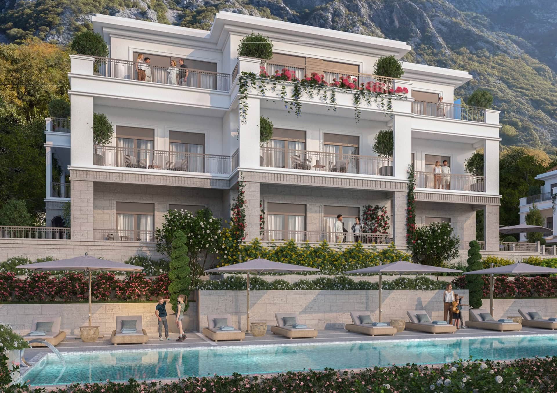 Complexe résidentiel moderne à Luštica, Monténégro : bâtiment de trois étages avec piscine, terrasses et vue sur les montagnes.