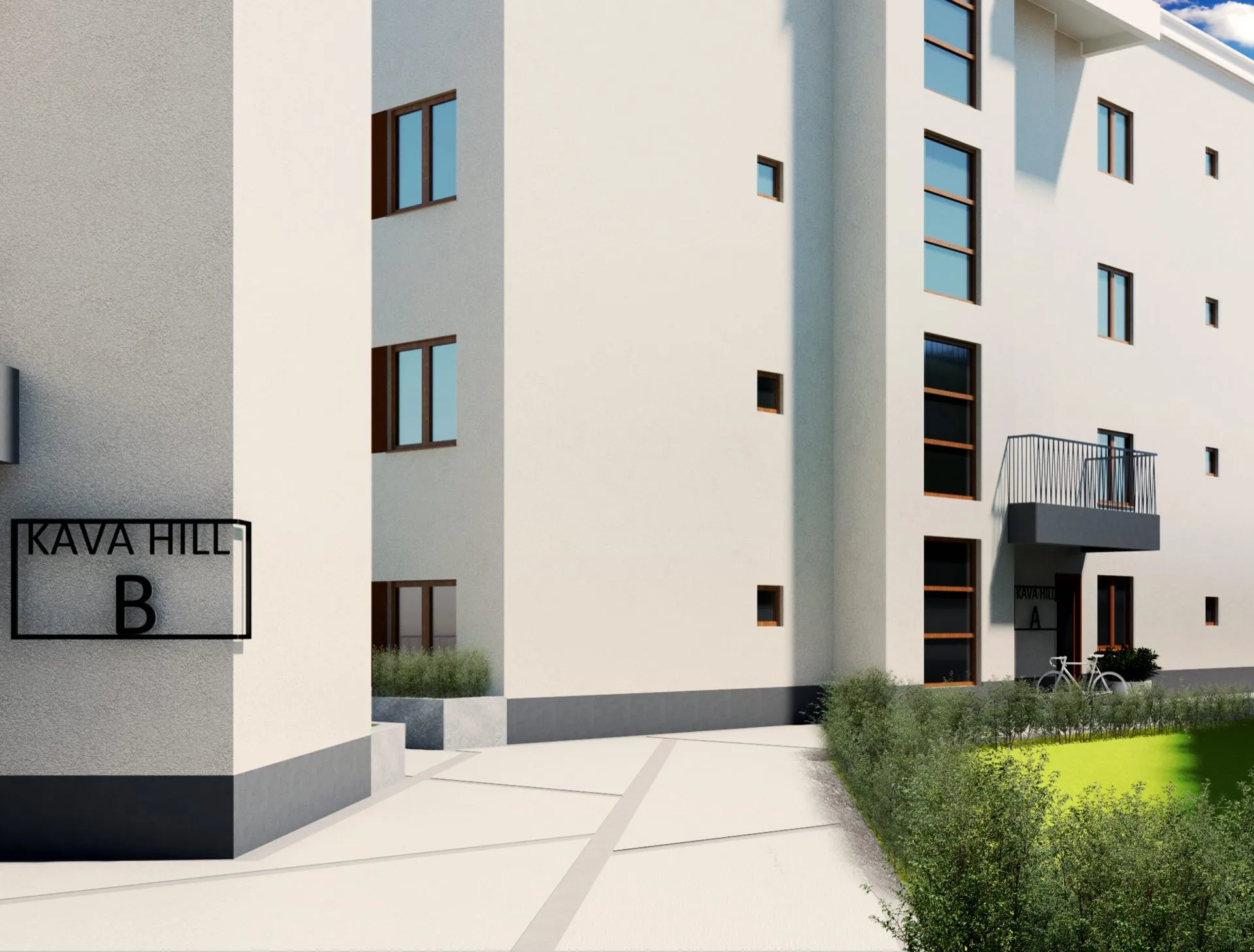Modern residential complex Kava Hill B featuring white walls, dark-framed windows, and green landscaping under a blue sky.
