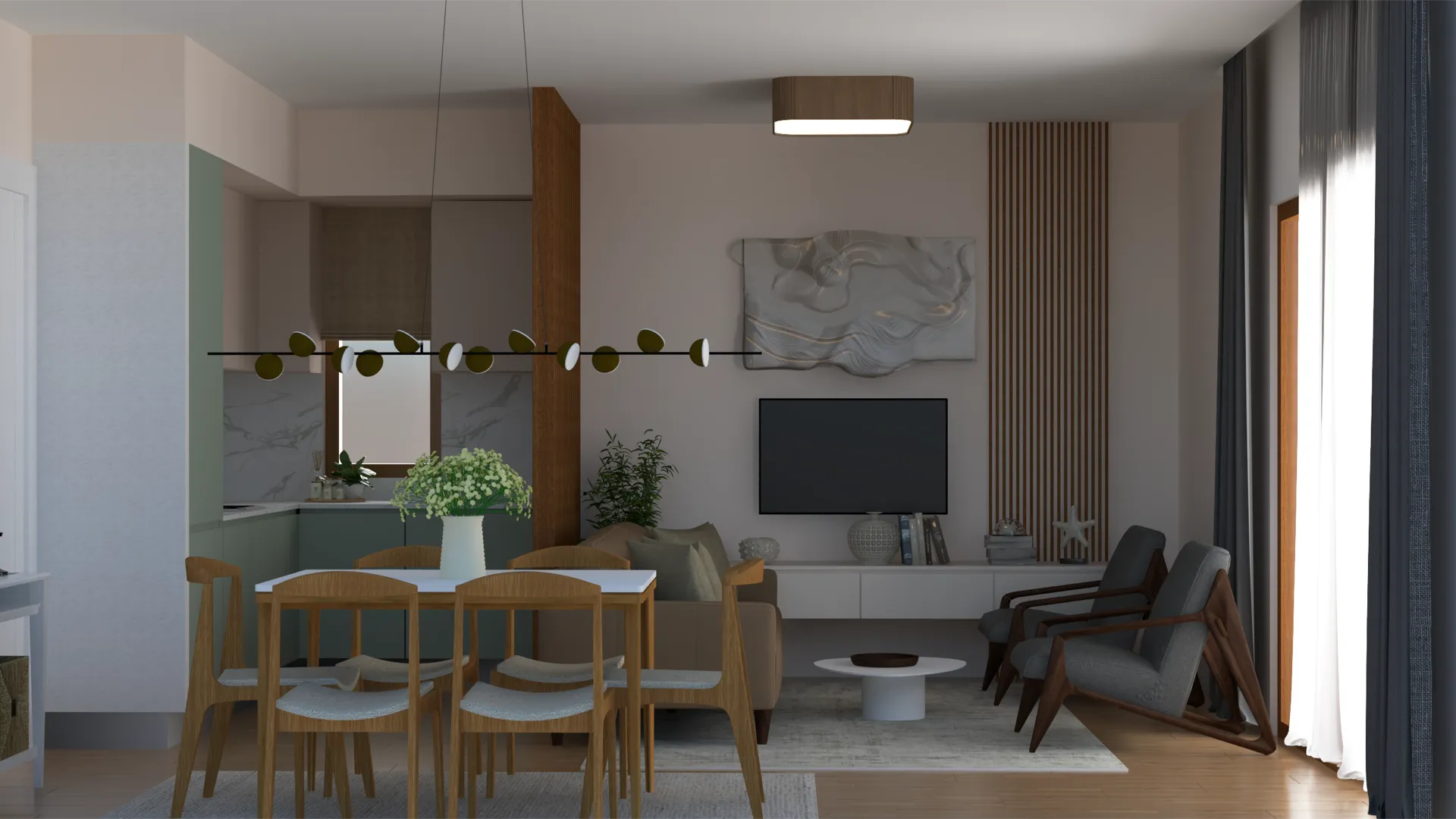 Modern living room featuring a wooden dining table, grey armchairs, wall-mounted TV, and an open kitchen area visible in the background.