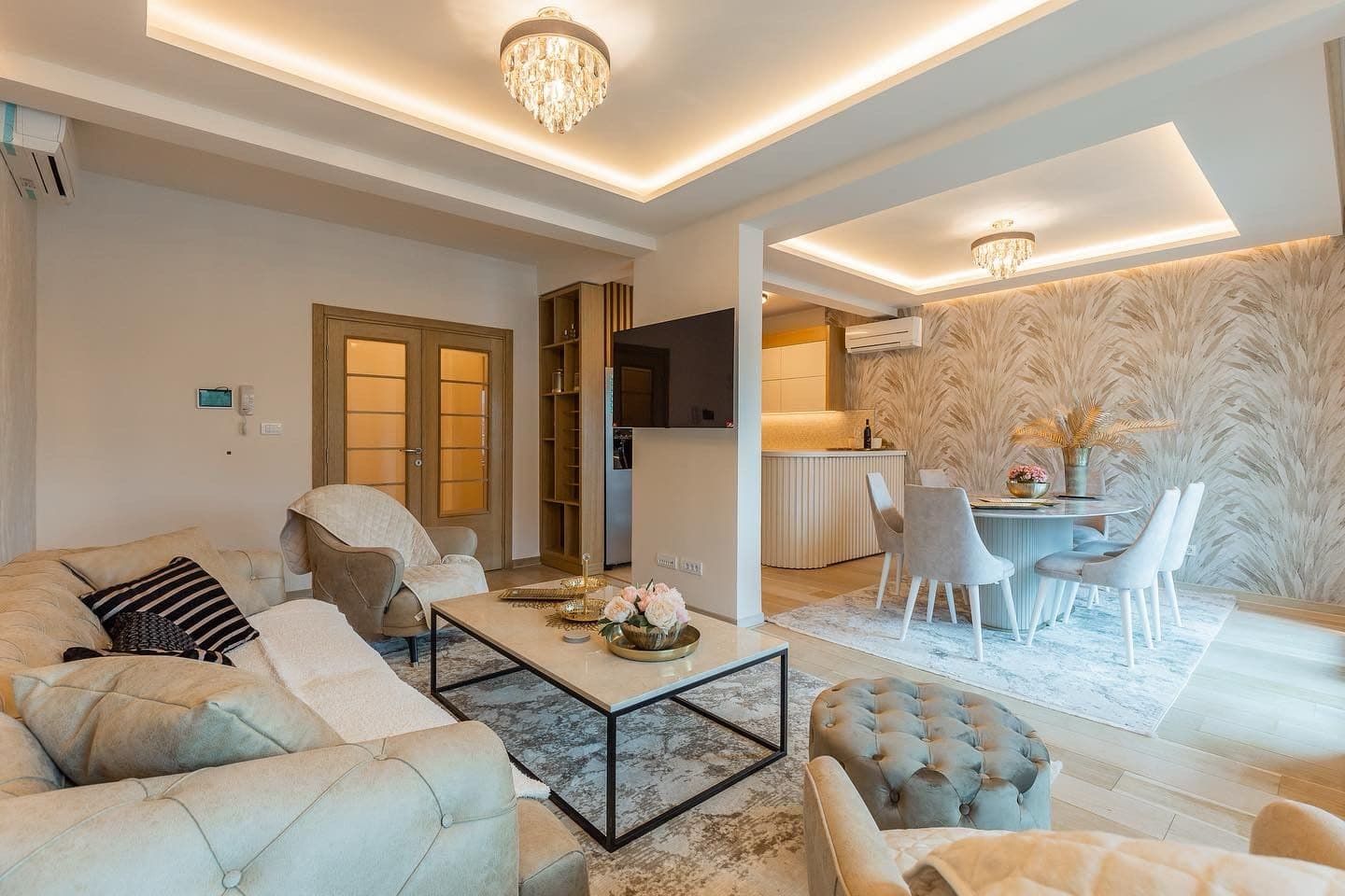 Modern living room with dining area in a penthouse, Pržno, Montenegro: stylish furniture, designer lighting, and decor.