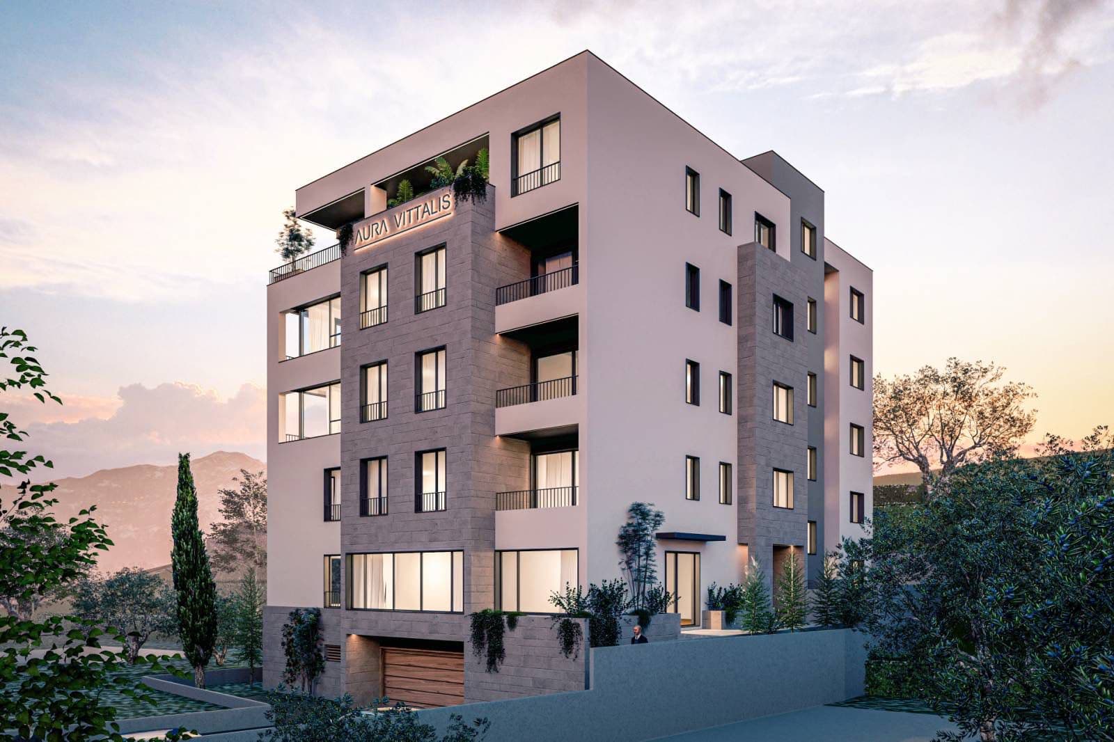 Ein modernes mehrstöckiges Wohngebäude mit Balkonen und heller Fassade.