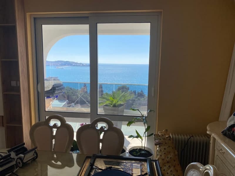 Living room with panoramic sea view in a house, Shushan, Montenegro: bright room with dining area and access to the balcony.