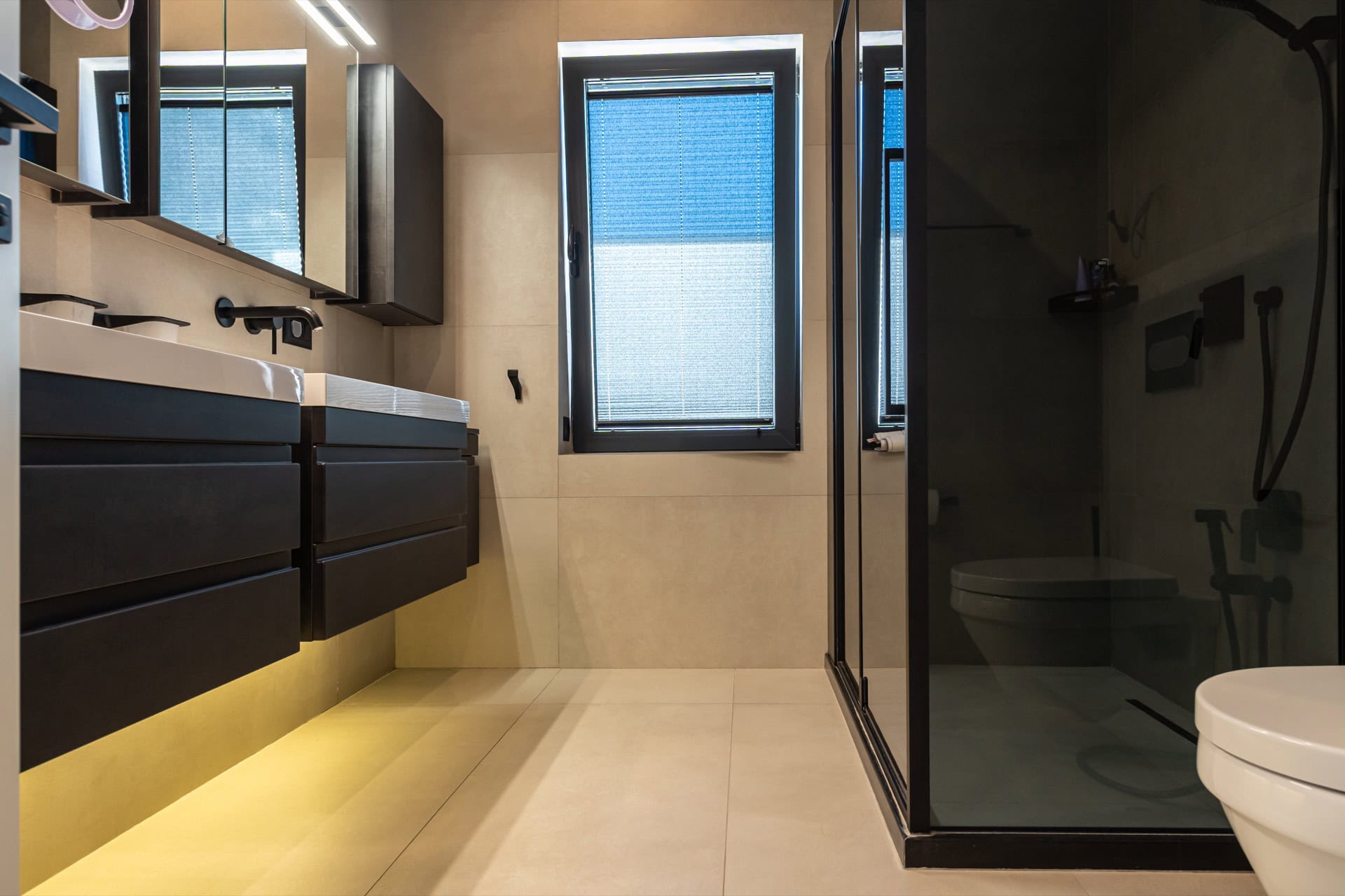 Modern bathroom with a shower cabin and lighting in a villa, Kavac, Montenegro. High-quality finishes and plumbing fixtures.