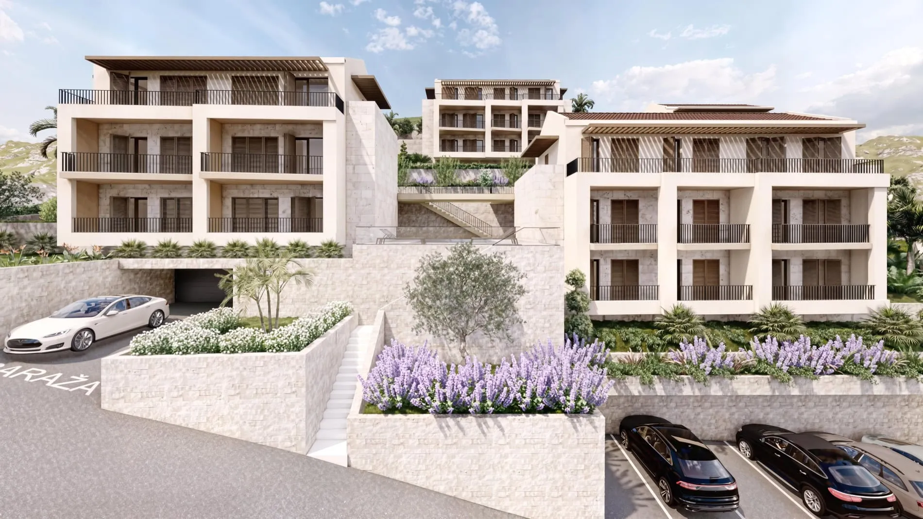 Architectural rendering of a multi-story residential complex featuring balconies, parking areas, and landscaped flower beds against hills.