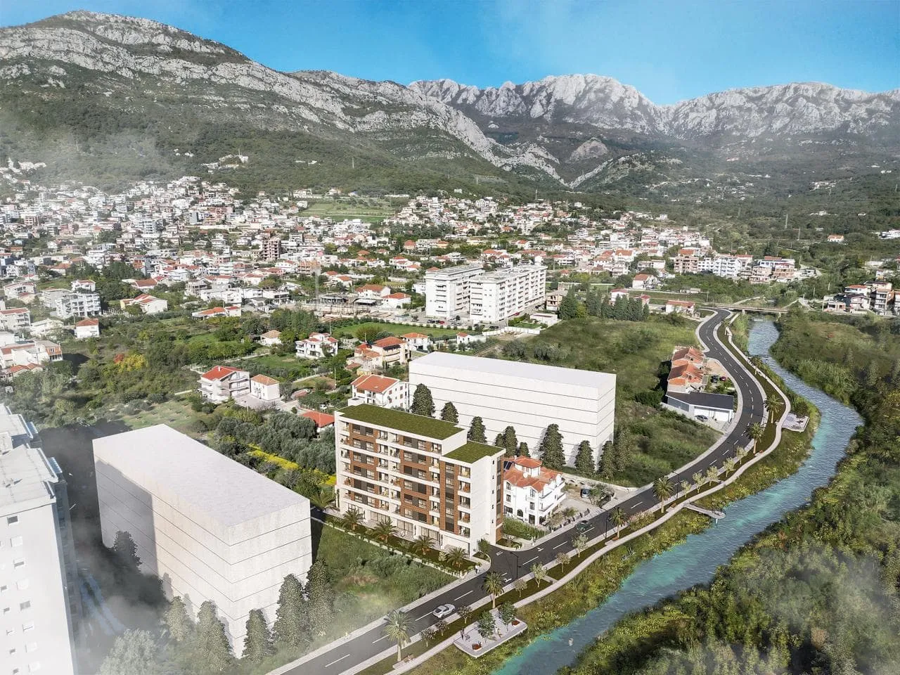 Rendering of a residential complex under construction with mountains in the background