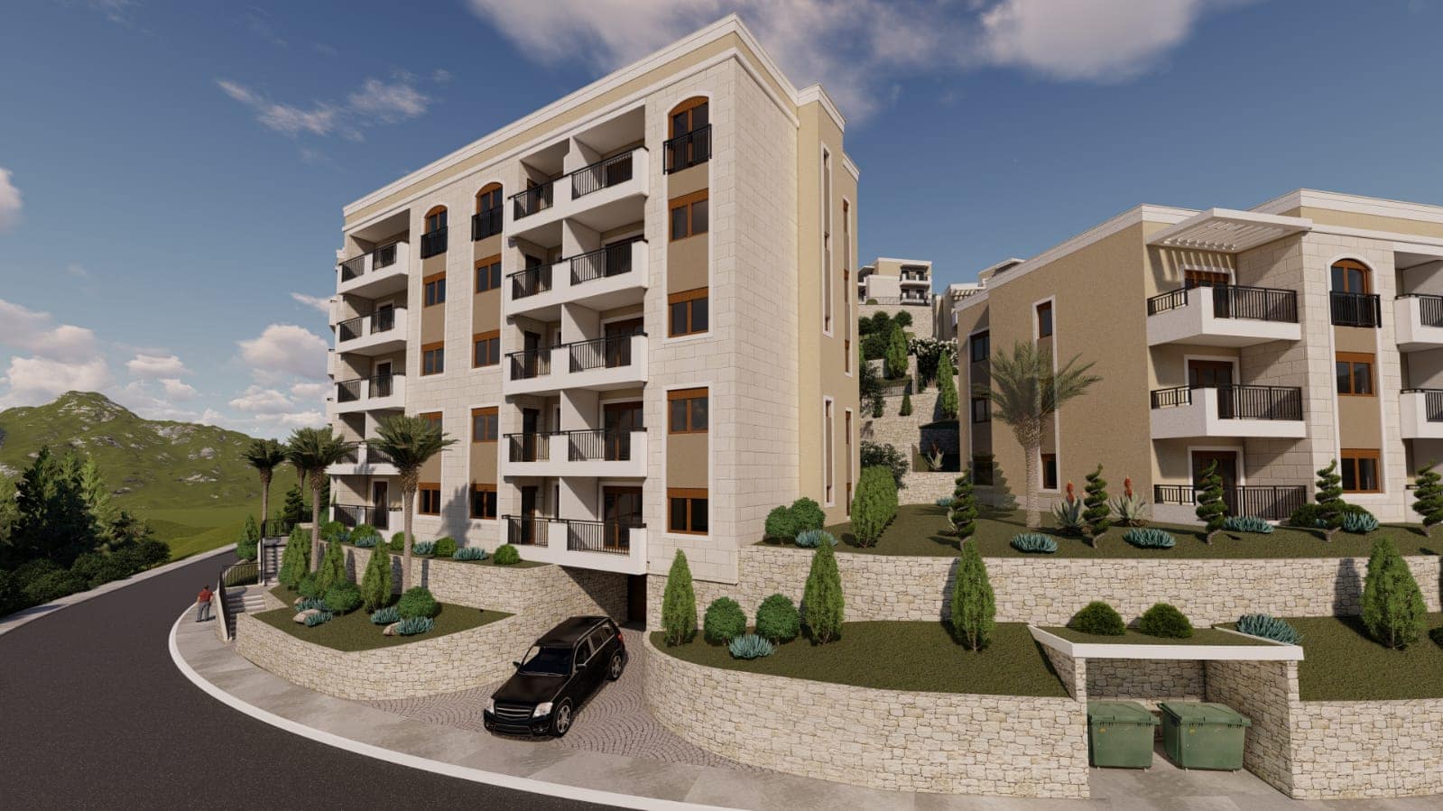 Moderner Wohnkomplex in Budva, Montenegro: Steinfassade, Balkone mit Geländern und gepflegte Außenanlage.