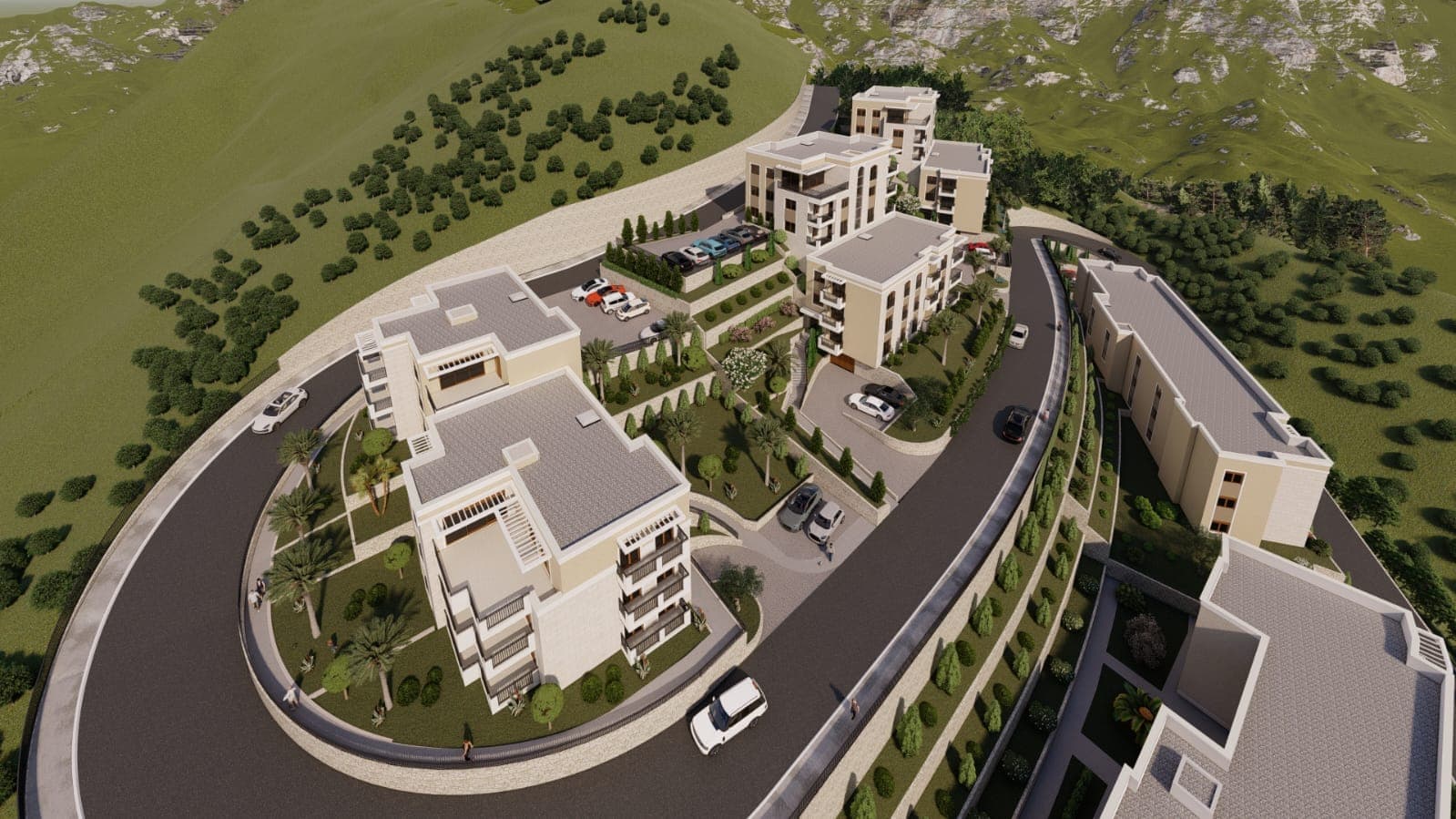 Blick von oben auf einen modernen Wohnkomplex in Budva, Montenegro: Mehrfamilienhäuser, Parkplatz und Landschaftsgestaltung.