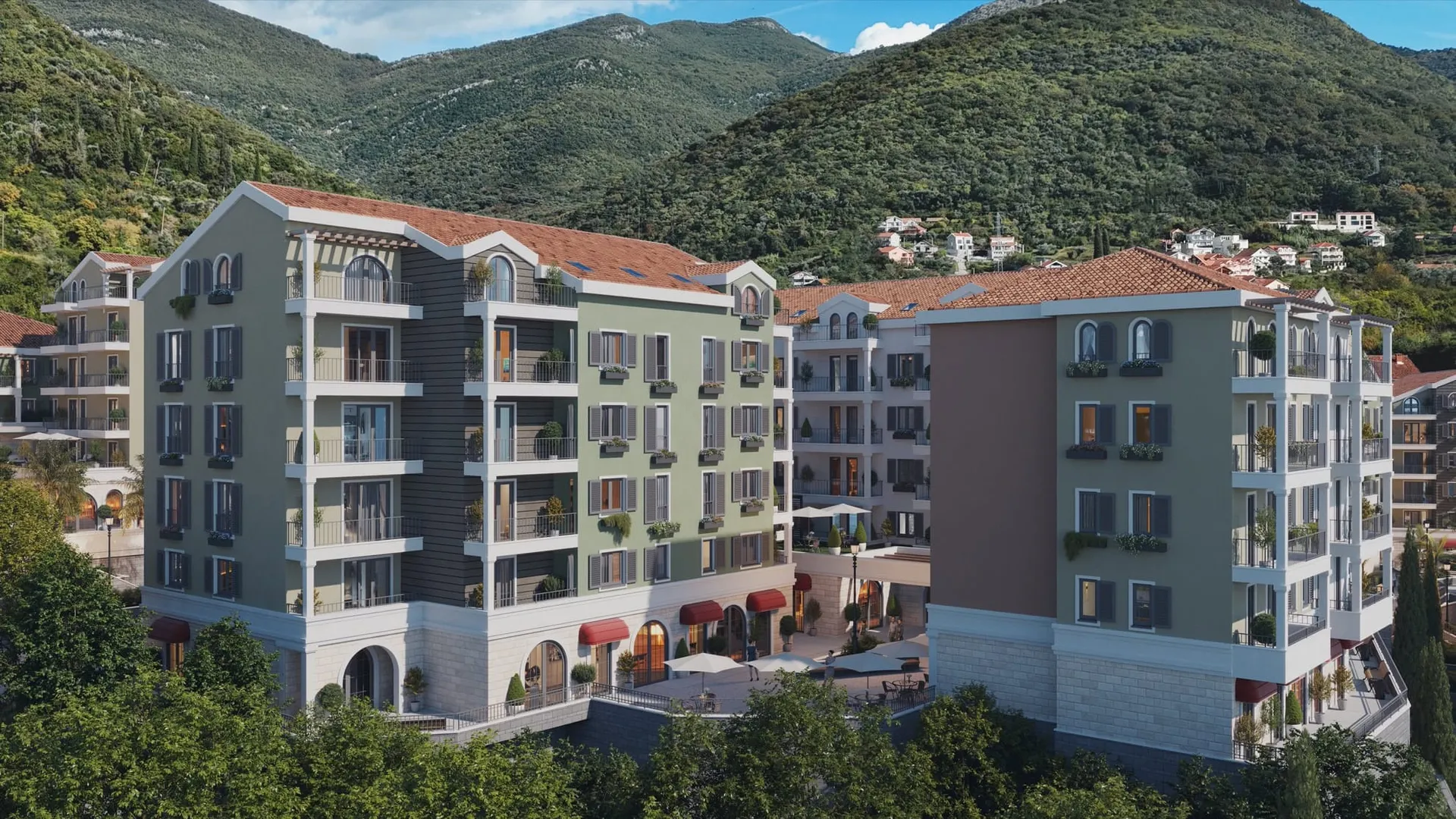Dağların fonunda Akdeniz tarzında çok daireli konut komplekslerinin render'ı