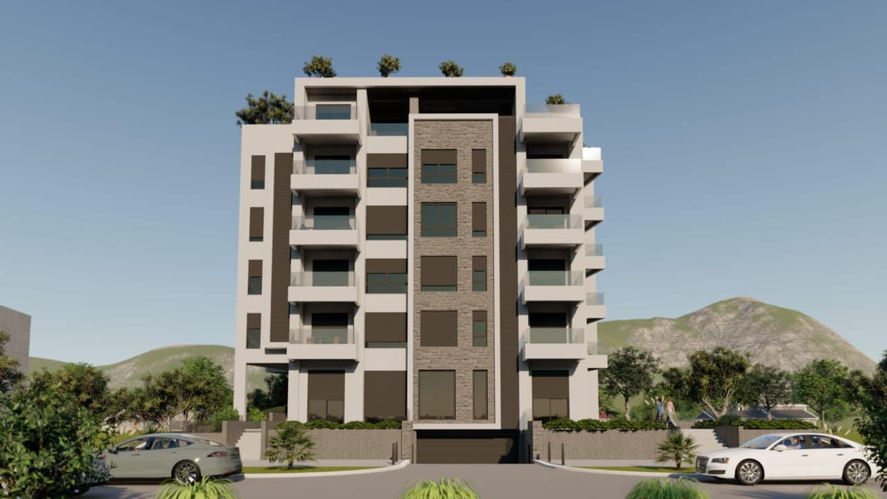 Complexe résidentiel moderne à Shushan, Monténégro : immeuble de plusieurs étages avec terrasses, parement en pierre et vue sur les montagnes.