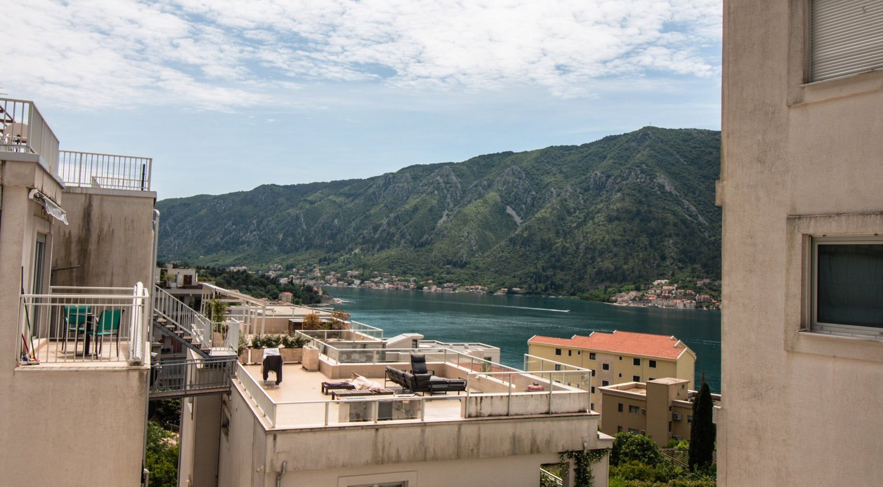 View from the terrace of Kotor Bay and the mountains in Dobrota, Montenegro: furnished terrace and panoramic sea view.
