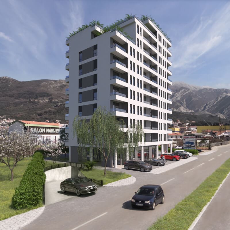 Moderner Wohnkomplex in der Stadt Bar, Montenegro: mehrstöckiges Gebäude mit Balkonen, Parkplatz und Bergblick.
