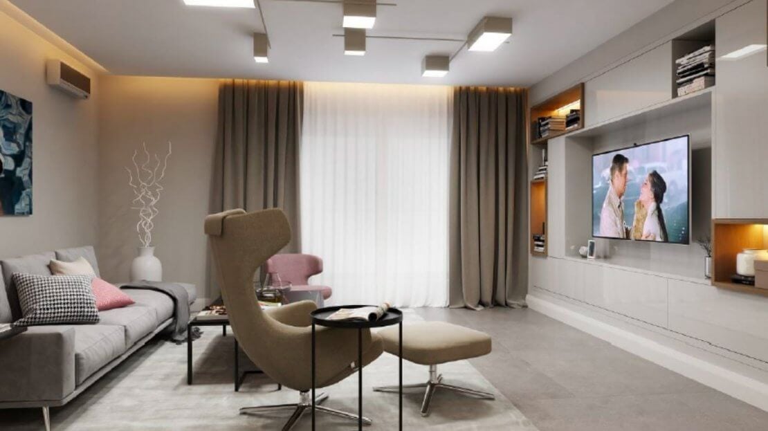 Modernes Wohnzimmer mit Sofa, Sessel und TV-Bereich in einer Wohnung in Bečići, Montenegro