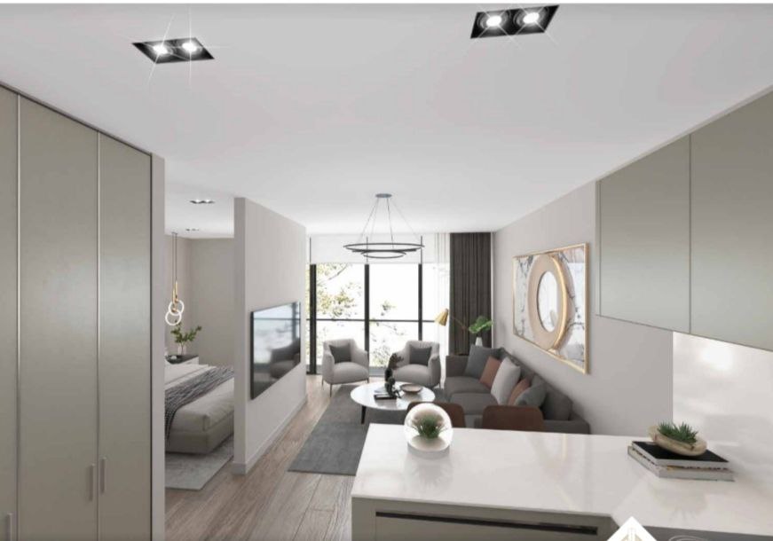 Modernes Wohnzimmer mit Küche in einer Wohnanlage in Bar, Montenegro: stilvolles Interieur, Panoramafenster und hochwertige Ausstattung.