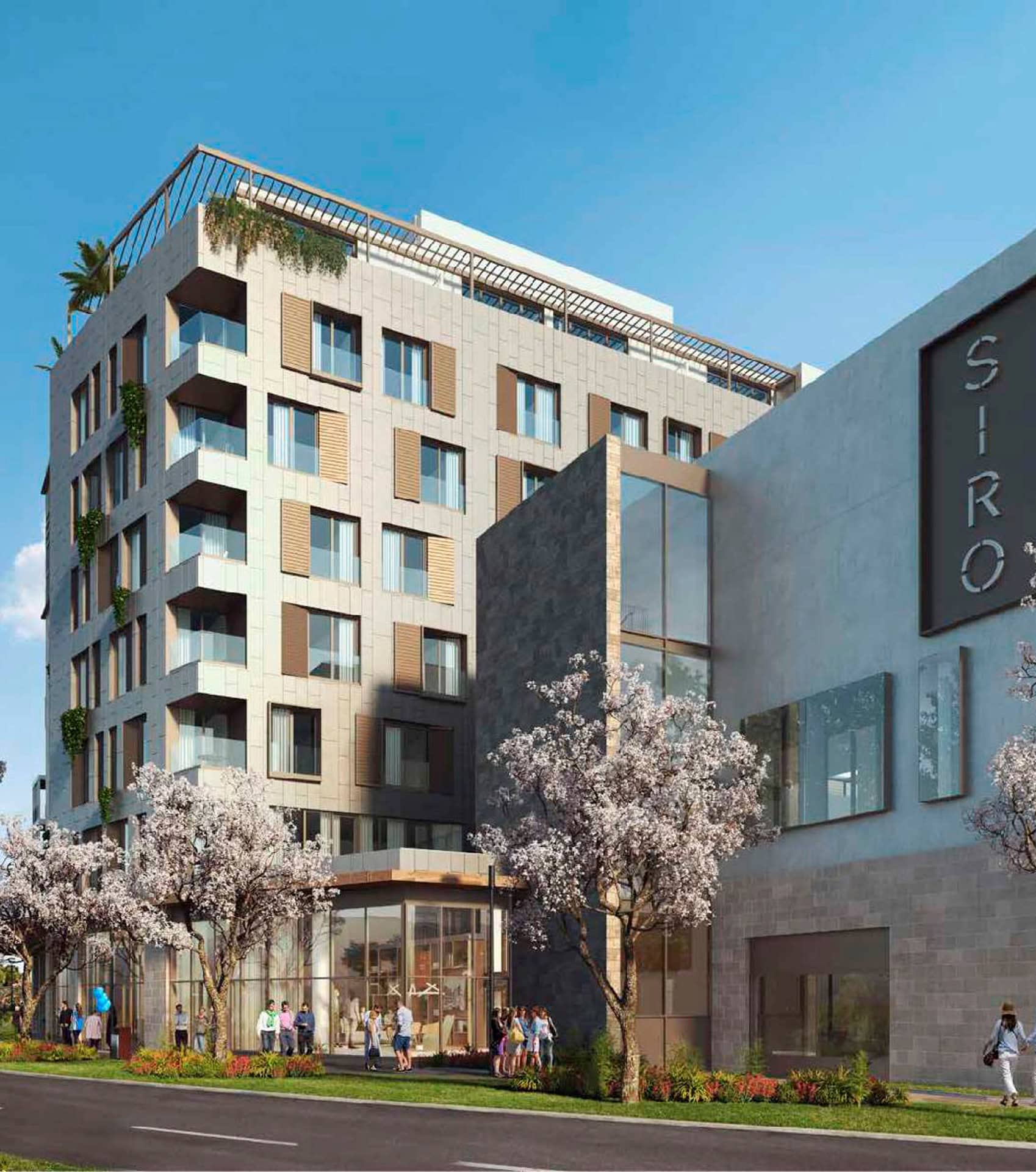 Moderan hotel SIRO u Boka Place, Tivat, Crna Gora: fasada zgrade sa panoramskim prozorima i cvetnim drvećem.