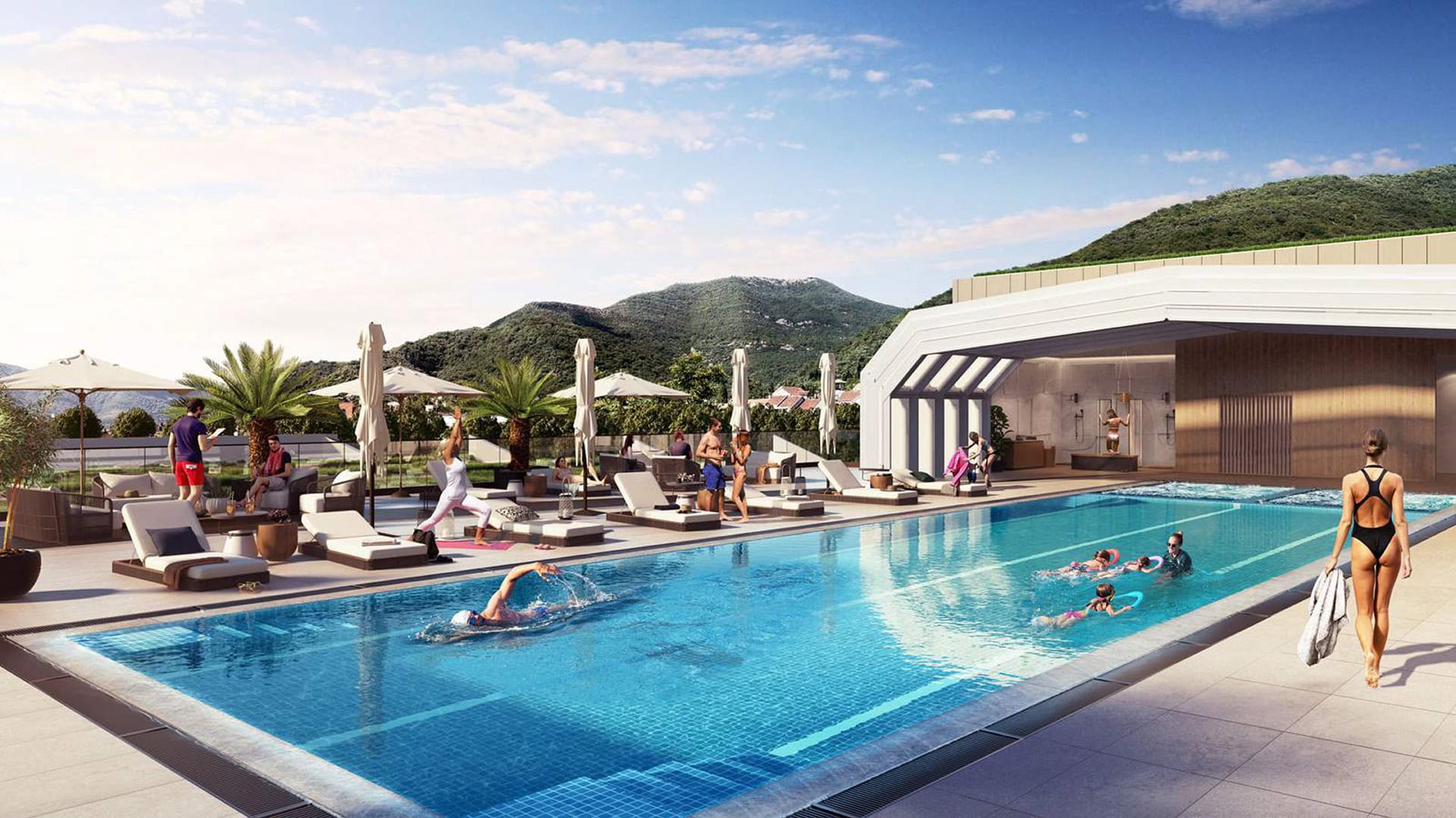 Otvoreni bazen u hotelu Boka Place, Tivat, Crna Gora: ležaljke, terasa i pogled na planine za odmor gostiju.
