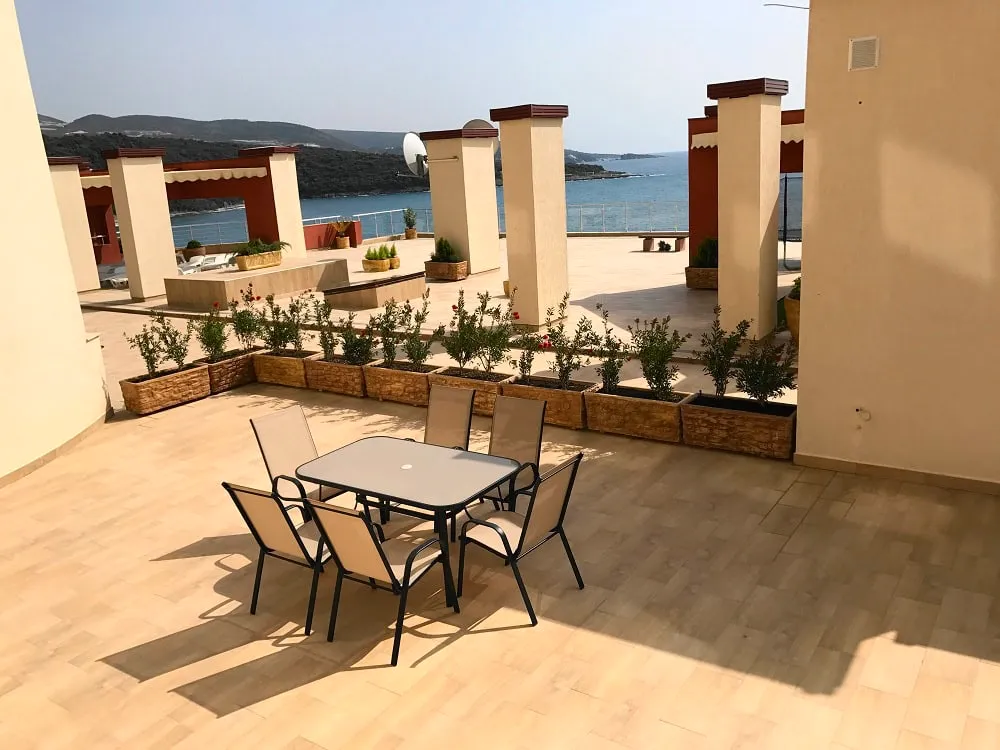 Spacious terrace with furniture and panoramic sea view in Dobra Voda, Montenegro. Apartment with a furnished veranda.