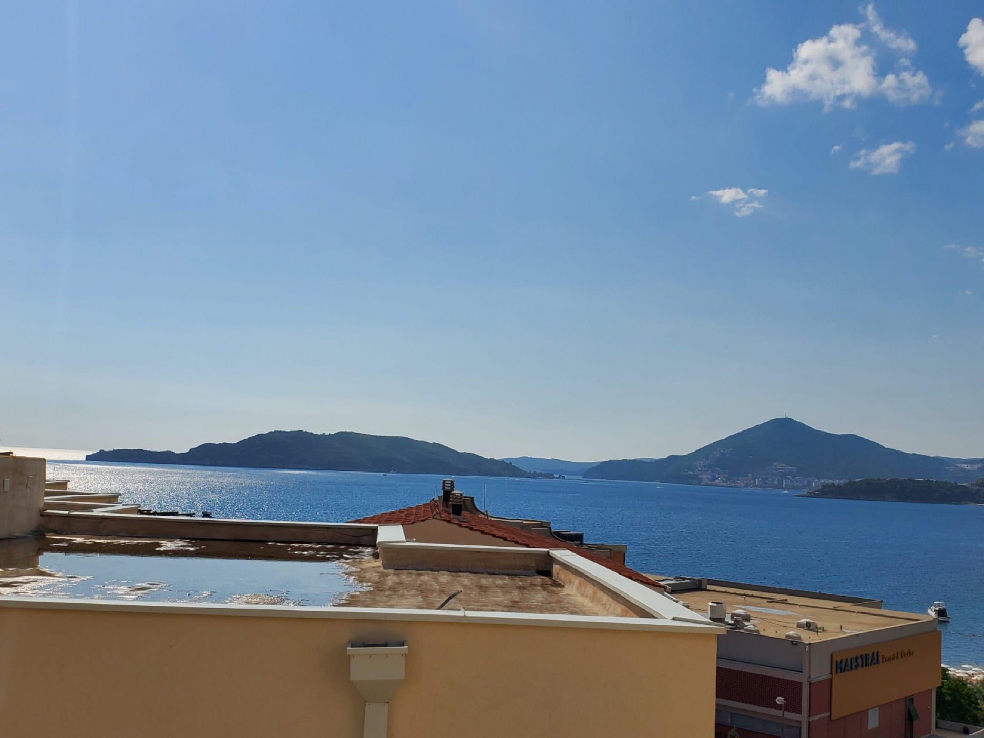Panoramic view of the Adriatic Sea and mountains from the penthouse terrace in Pržno, Montenegro.