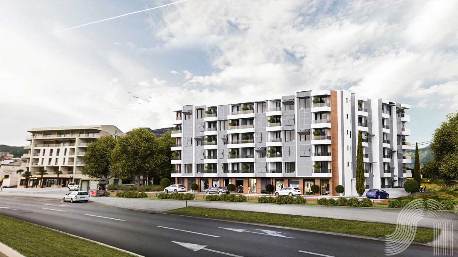 Moderner Wohnkomplex in der Stadt Bar, Montenegro: Gebäudefassade mit Balkonen, Gewerbeflächen und Parkplatz.