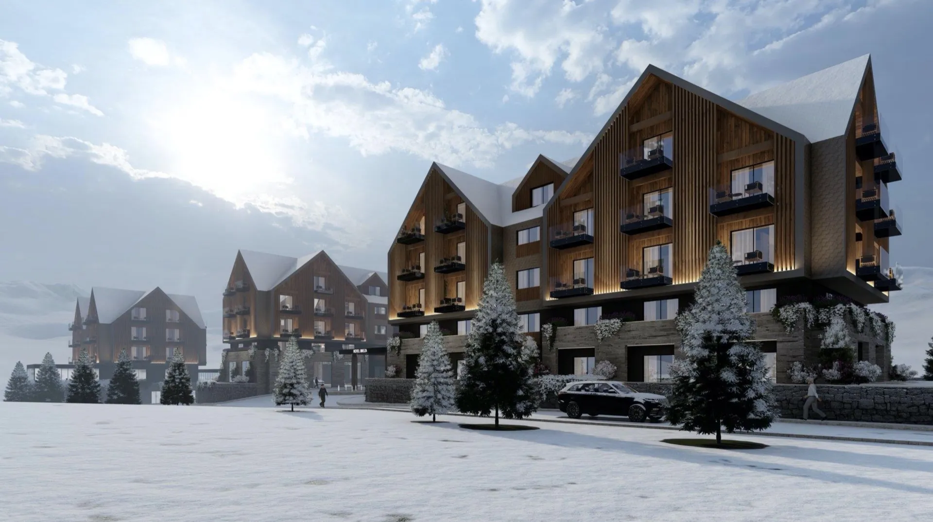 Karlı çatılara ve çam ağaçlarına sahip modern ahşap dağ tatil otellerinin karlı dış görünümü.