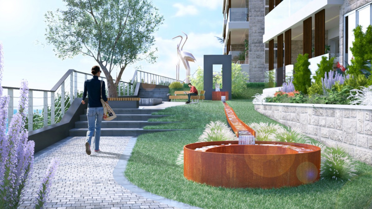 Gepflegtes Gelände der Wohnanlage in Budva, Montenegro: Landschaftsgestaltung, Brunnen und Spazierwege.