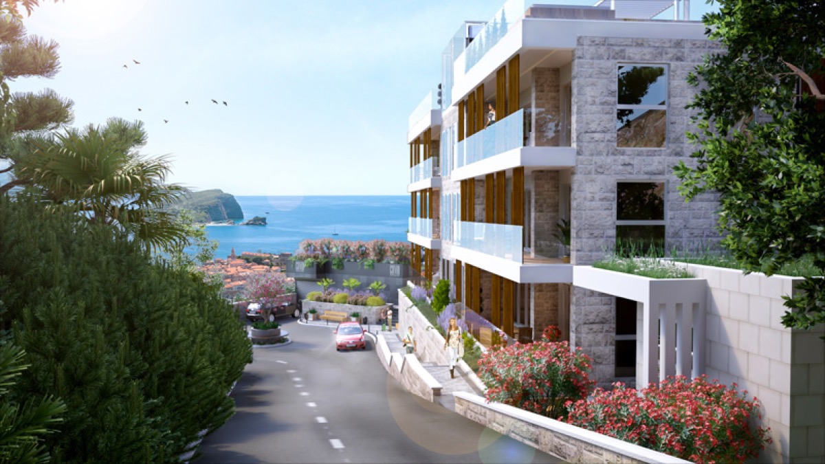 Moderner Wohnkomplex in Budva, Montenegro: Steinfassade, Panoramaterrassen und Blick auf das Meer und die Altstadt.